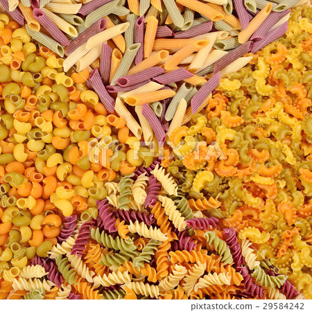 Assortment of colored uncooked Italian pasta 29584242