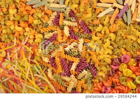 Assortment of colored uncooked Italian pasta  29584244