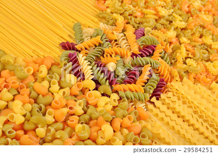 Assortment of colored uncooked Italian pasta 29584251