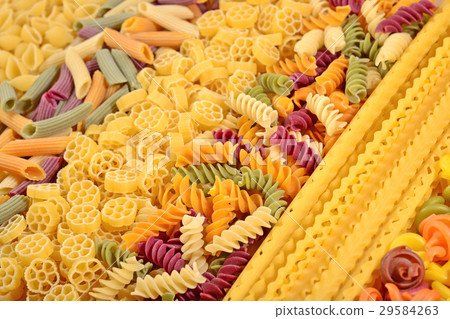 Assortment of colored uncooked Italian pasta 29584263