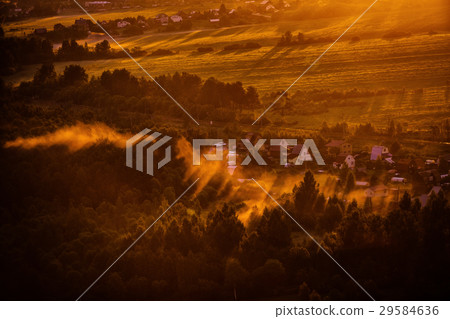 Dawn mist over the forest and village, Russia Dawn mist over the forest and village, Russia 29584636