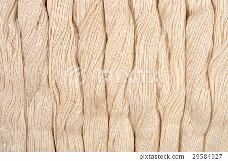 Beige skeins of floss as background texture Beige skeins of floss as background texture 29584927
