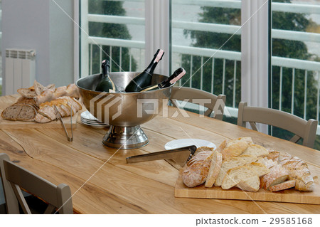 table with cutted bread on wooden board  29585168