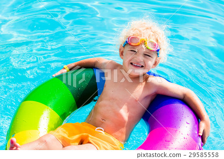 Child with toy ring in swimming pool Child with toy ring in swimming pool 29585558