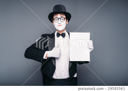 Pantomime actor performing with empty paper sheet 29585561