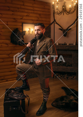 Respectable hunter man with old gun  29585568