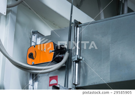 Orange damper actuator installed on the ductwork Orange damper actuator installed on the ductwork 29585905