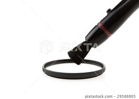 Cleaning a filter of camera with a tool 29588805