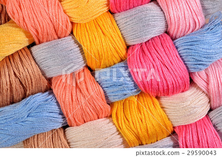 Colorful twisted skeins of floss as background Colorful twisted skeins of floss as background 29590043