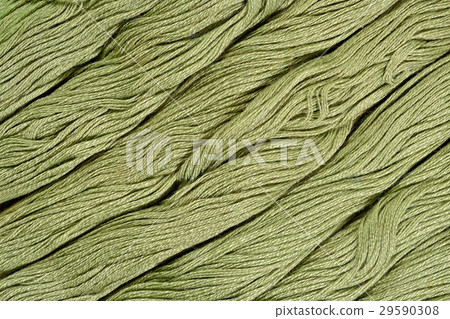 Green skeins of floss as background texture Green skeins of floss as background texture 29590308