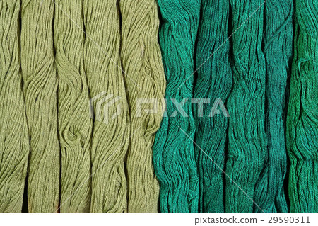 Green skeins of floss as background texture Green skeins of floss as background texture 29590311
