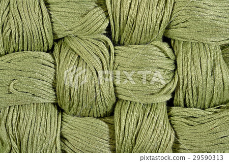 Green twisted skeins of floss as background Green twisted skeins of floss as background 29590313