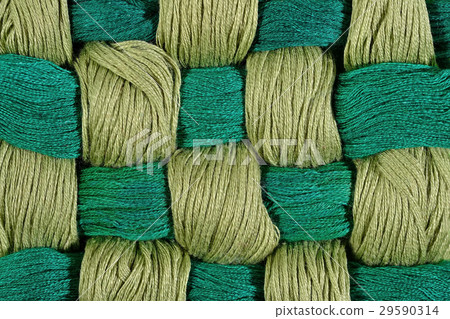 Green twisted skeins of floss as background Green twisted skeins of floss as background 29590314