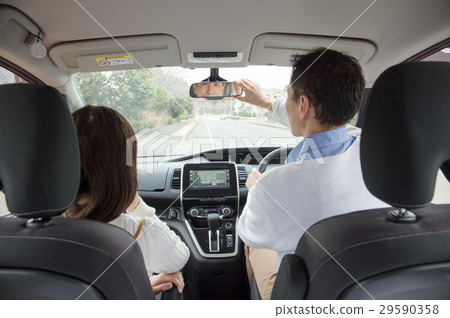 A man who fixes room mirror 29590358