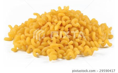Heap of uncooked italian pasta on a white 29590417