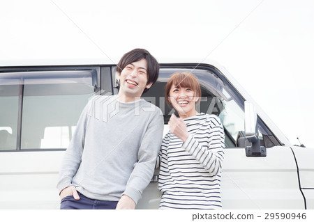 20's couple talking in front of the car 20's couple talking in front of the car 29590946