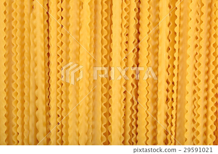 Uncooked Italian pasta mafaldine background 29591021