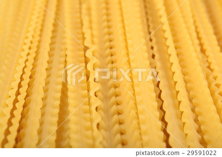 Uncooked Italian pasta mafaldine close up 29591022