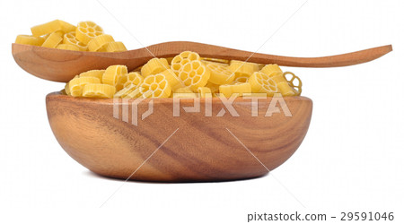 Uncooked italian pasta rotelle in a wooden bowl 29591046