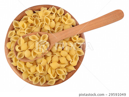 Uncooked italian pasta shells in a wooden bowl Uncooked italian pasta shells in a wooden bowl 29591049