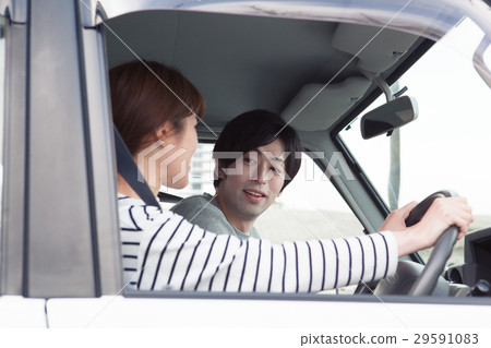 20's couple driving by car 20's couple driving by car 29591083