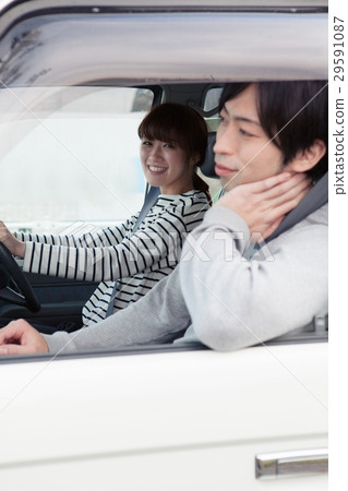 20's couple driving by car 20's couple driving by car 29591087