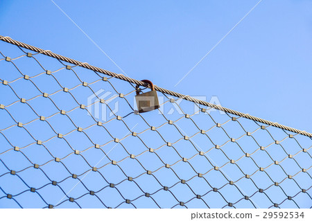 close up a key lock hook on iron wire gates and close up a key lock hook on iron wire gates and 29592534