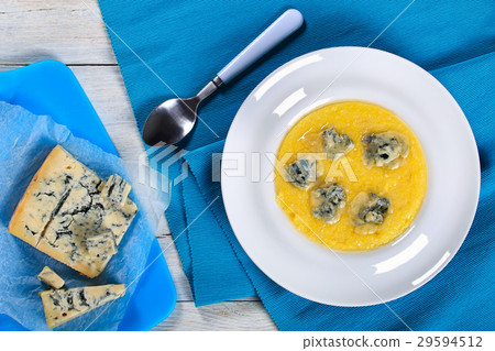 polenta porridge with butter and grated cheese polenta porridge with butter and grated cheese 29594512