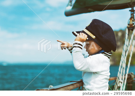 Funny baby captain on board of sailing yacht 29595698