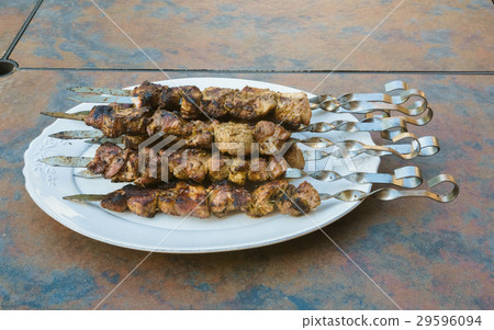 Juicy slices of meat with sauce prepare on fire Juicy slices of meat with sauce prepare on fire 29596094
