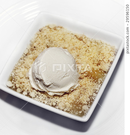 Apple crumble dessert with vanilla ice cream 29596150