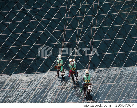 men cleaning glass building 29597367