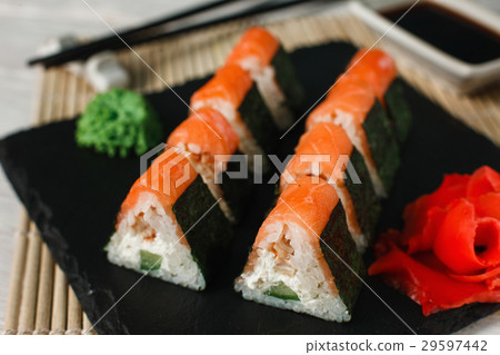 Delicious fresh sushi with salmon on black slate 29597442