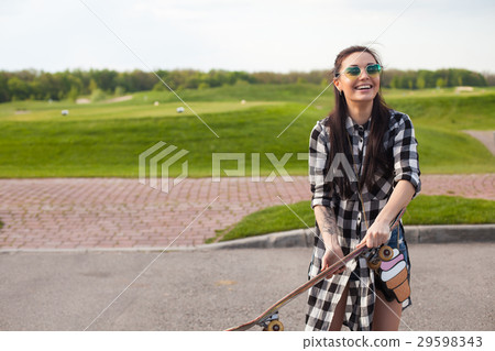 The woman is with skate 29598343