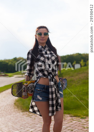 The woman holds a skate The woman holds a skate 29598412
