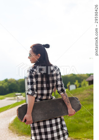 The woman holds a skate 29598426
