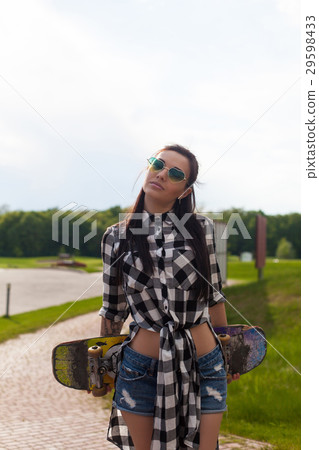 The woman holds a skate 29598433
