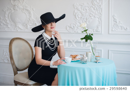 Woman in hat, much like the famous actress 29598640