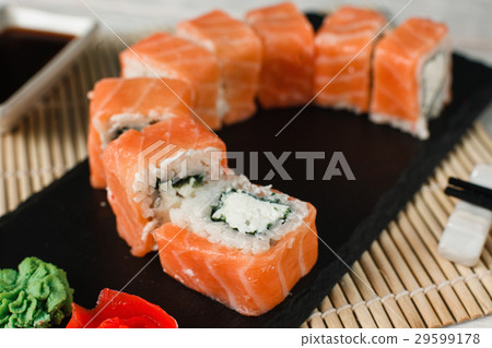 Appetizing salmon rolls. Japanese sushi, closeup. Appetizing salmon rolls. Japanese sushi, closeup. 29599178
