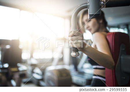 Close up woman's hand fitness in the gym. Close up woman's hand fitness in the gym. 29599335