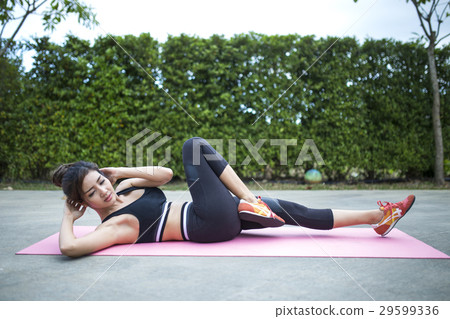 Young fit woman exercising Young fit woman exercising 29599336