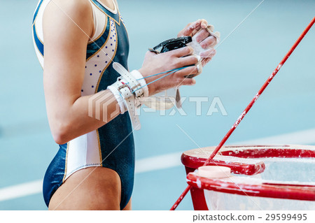 female gymnast exercise on uneven bars female gymnast exercise on uneven bars 29599495