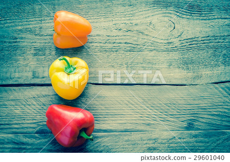 Bell peppers on the wooden background Bell peppers on the wooden background 29601040