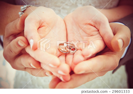 Hands and rings on wedding bouquet Hands and rings on wedding bouquet 29601333