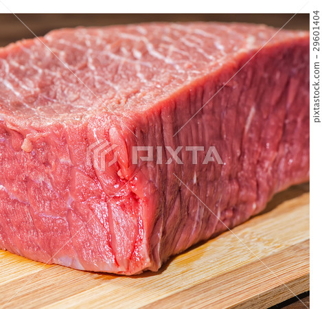 close up big fresh raw beef on wooden table 29601404
