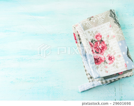 Vintage apron napkin on green wooden background Vintage apron napkin on green wooden background 29601698