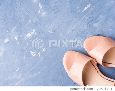 Pair of woman pink sandals on blue background 29601704
