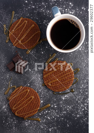 Stroopwafels with caramel sauce and coffee 29602377