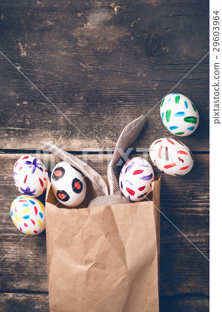 Easter bunny in a paper bag on old boards Easter bunny in a paper bag on old boards 29603964