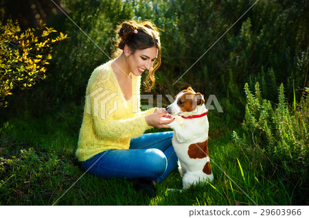 Beautiful young brunette woman enjoying in park Beautiful young brunette woman enjoying in park 29603966